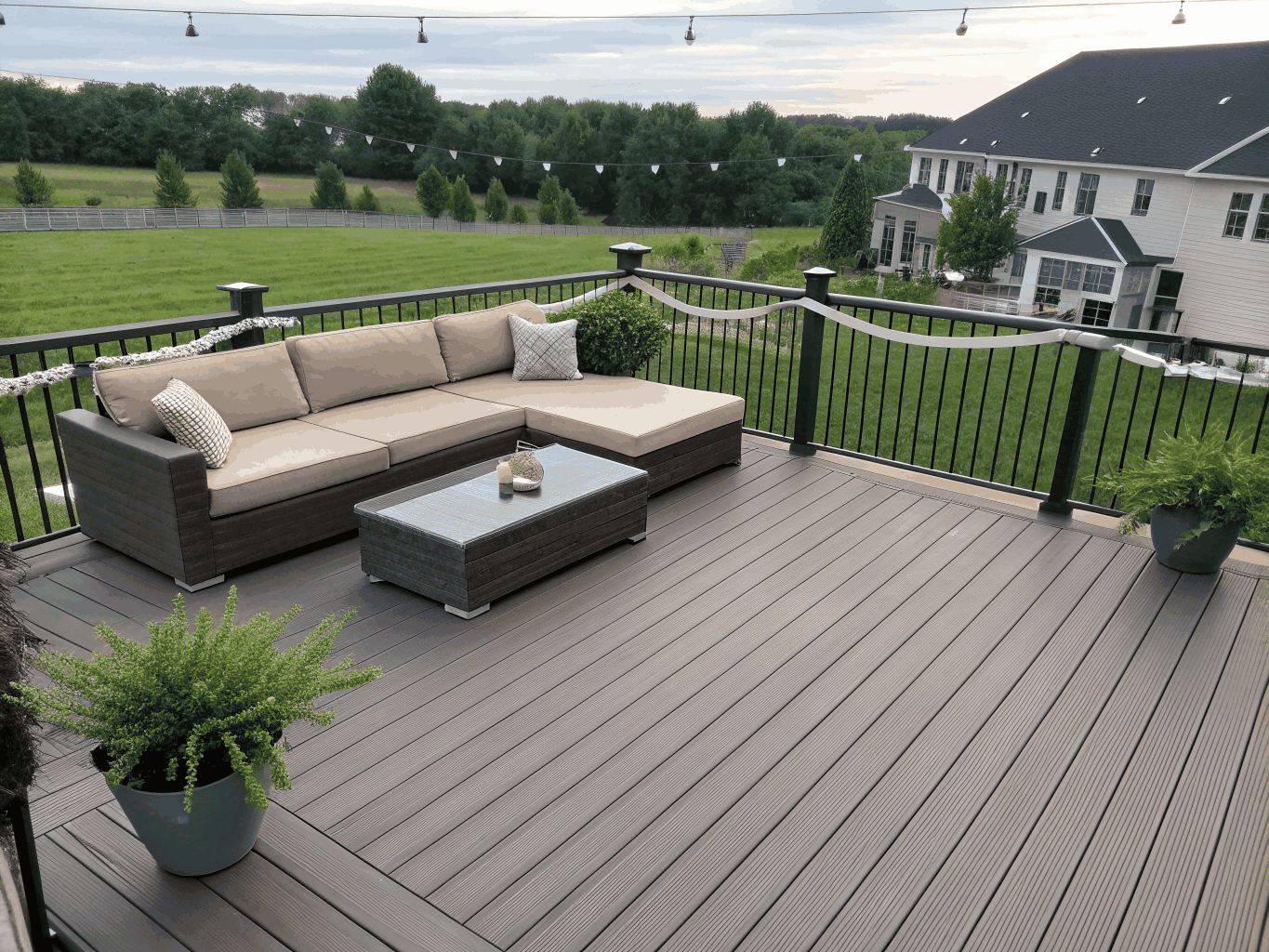 Motorized solar screens enclosing a patio area